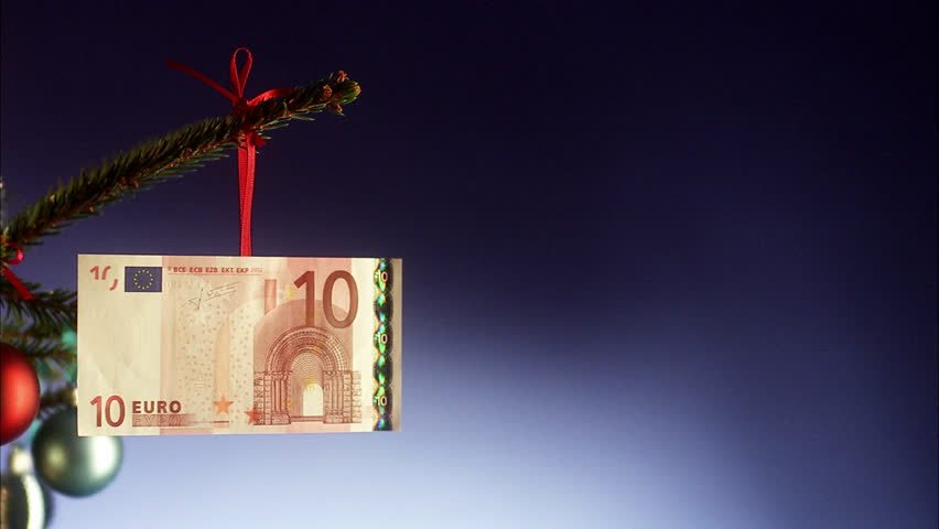 A euro note in a Christmas tree.