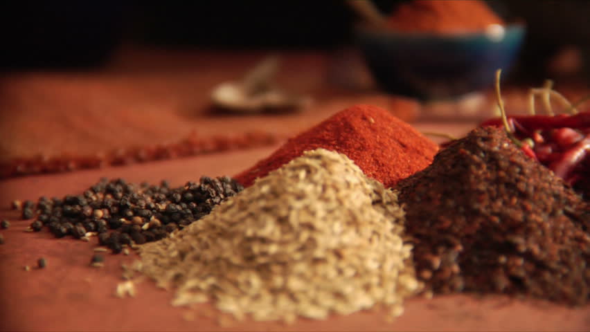 slow pan over peppers and a mountain of mexican spices