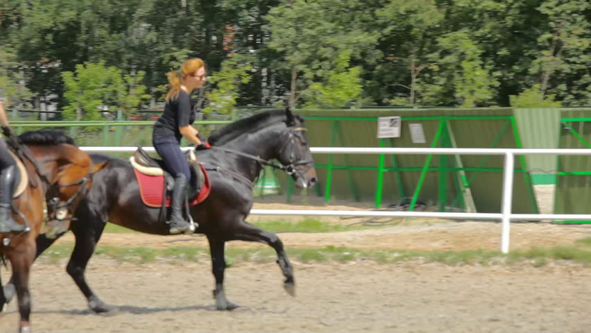 Woman rides horse
