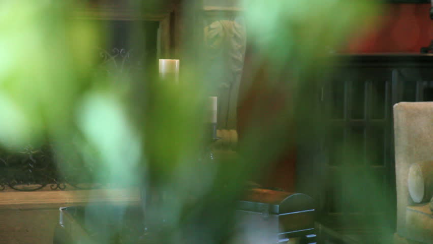 panning from right to left of candles on a accent table