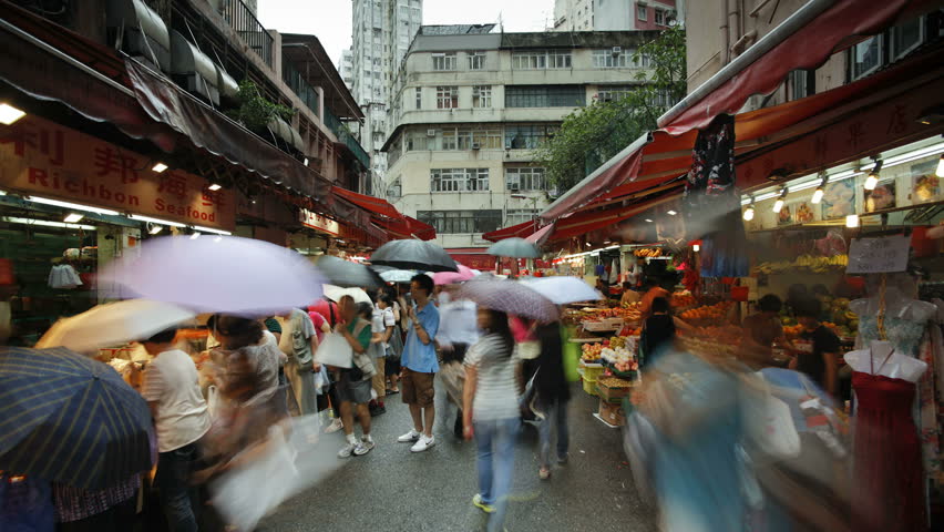 HONG KONG - CIRCA MAY 2011: Shoppers browse the traditional Chinese Stalls in Wanchai market
