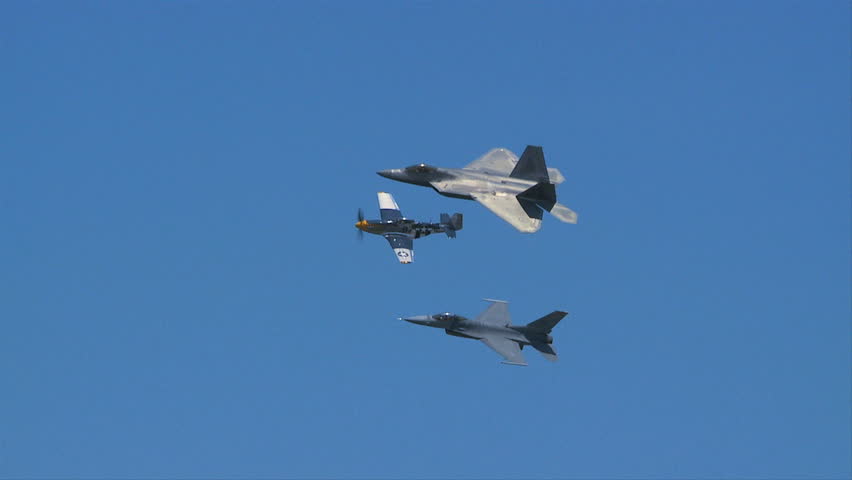 QUONSET, RHODE ISLAND - CIRCA JUNE 2012: Air force F-22 Raptor with F16 and P-51 Mustang in formation - 1
