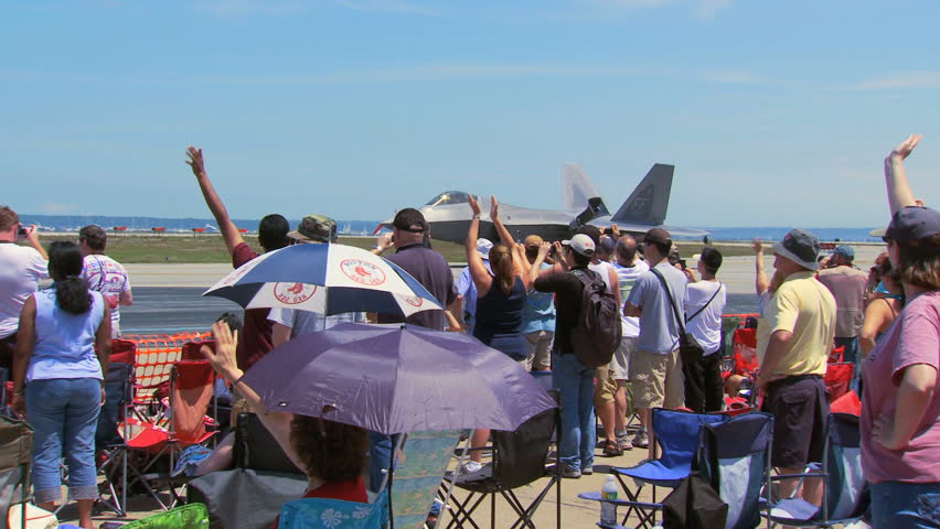 QUONSET, RHODE ISLAND - CIRCA JUNE 2012: Air force F-22 Raptor taxing on runway in front of crowd