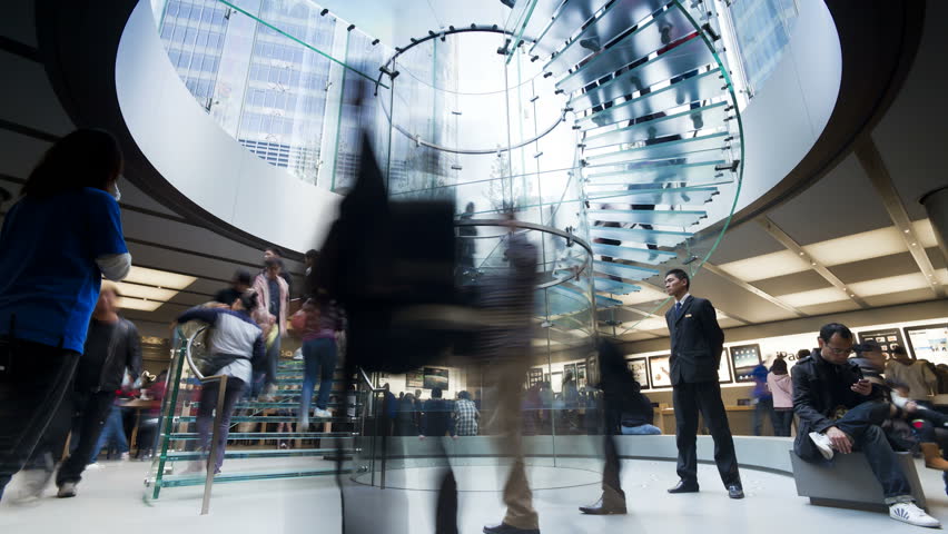 SHANGHAI, CHINA - CIRCA MAY 2011: shoppers inside a new modern shopping complex in Pudong district, Shanghai, China