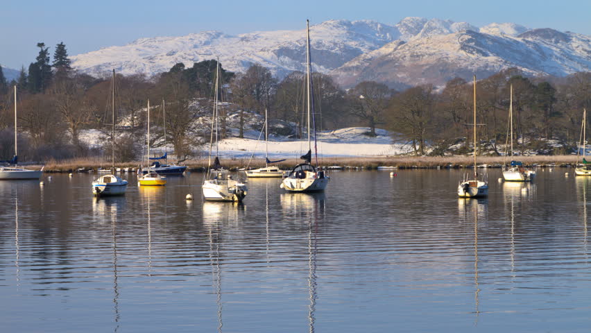 WATERHEAD, CUMBRIA/ENGLAND - JANUARY 7: Time lapse in Winter of pleasure yachts on Lake Windermere on January 7, 2012 in Waterhead. Lake Windermere is the largest natural lake in England.