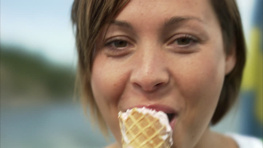 A woman eating an ice cream