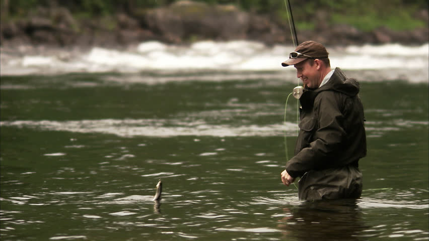 A man fly-fishing in a river
