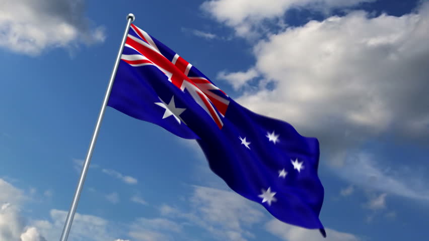 Australian flag waving against time-lapse clouds background