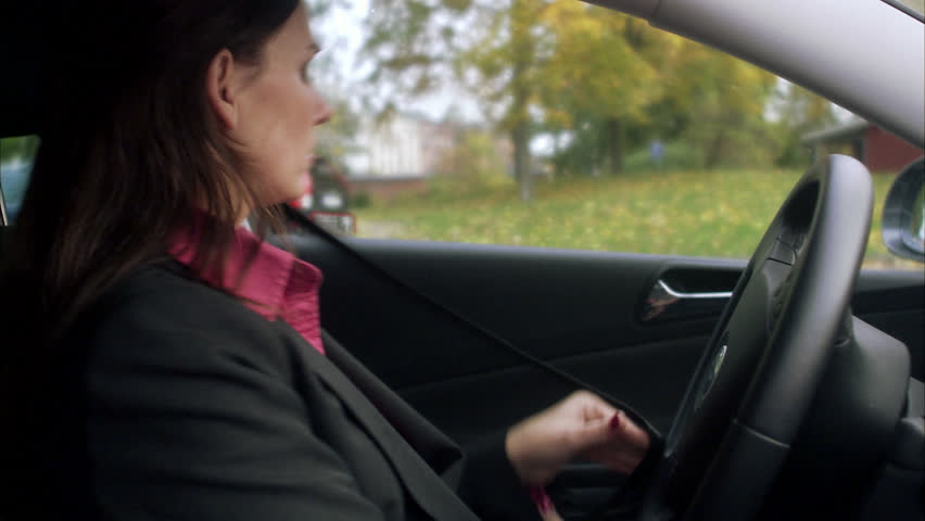 Woman getting into a car