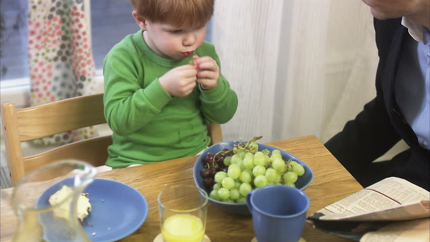 Father and son by a kitchen table