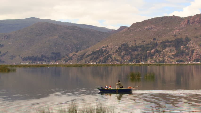 Small boat on Titicaca lake, Peru