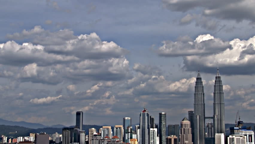 July 2012: Kuala Lumpur, Malaysia:  Timelapse of Petronas towers  with cloudy sky