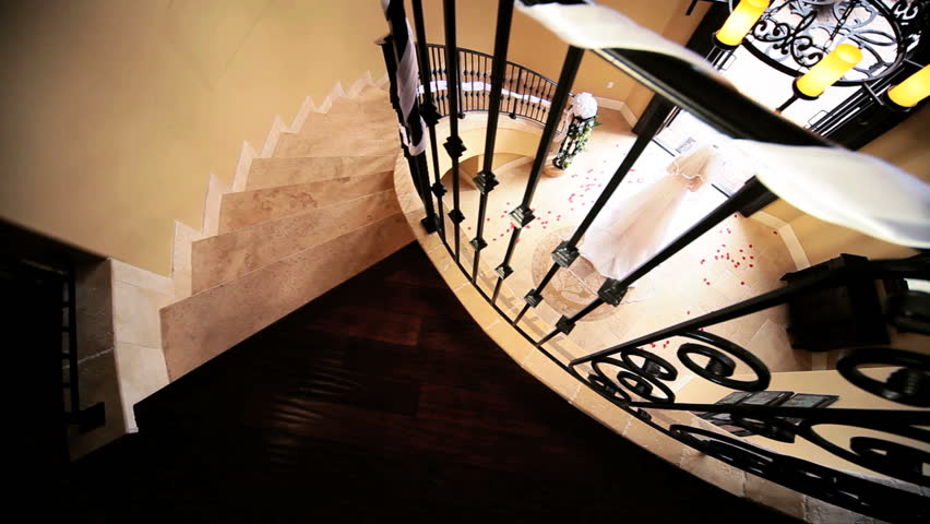Young Caucasian bride in full wedding dress veil standing elegant entrance hall luxury house