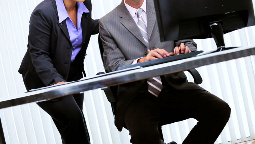 Ambitious Hispanic business team hearing good news via computer technology