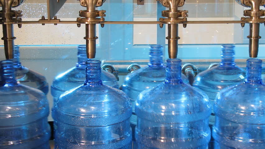 Bottled water factory. Production line. Time lapse, loopable.