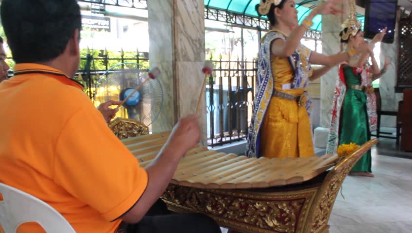 BANGKOK - CIRCA JULY 2012 : Many people visit "Pra Prum" to get a good luck at Era-wan junction circa July 2012 in Bangkok, Thailand.