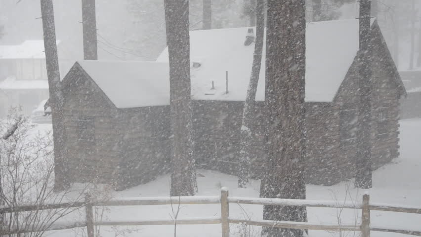  mountain cabin in a severe winter snowstorm