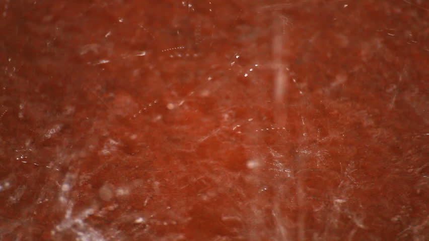 raindrops on red ceramic floor tile