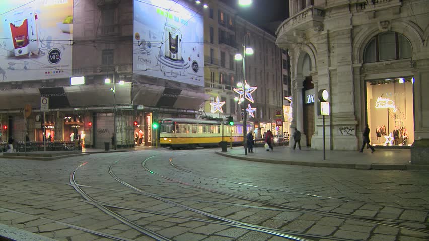 MILAN, ITALY-CIRCA 2011-A trolley passes at night on a street in Milan, Italy.