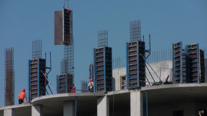 Working establish forms for concrete at a construction site