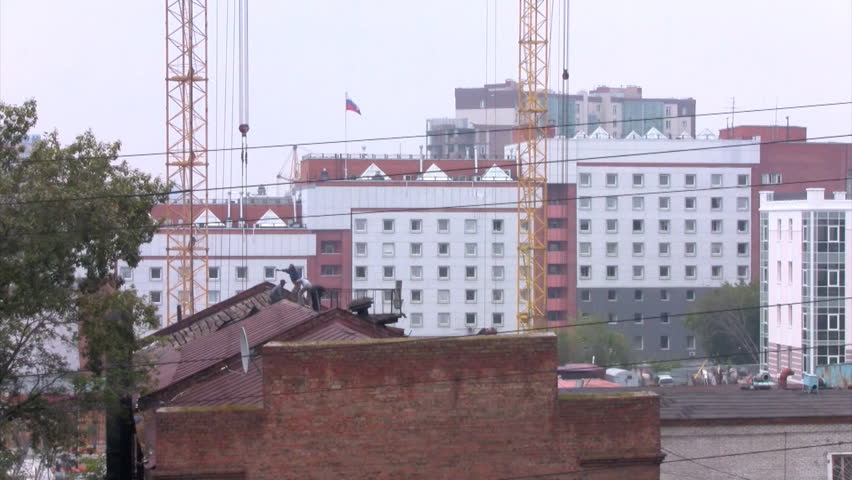 Time lapse workers dismantle the roof
