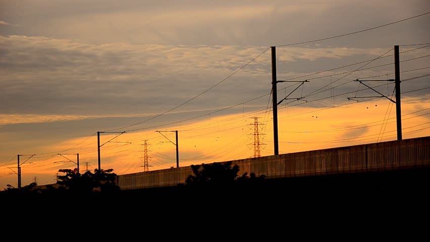 Sky Train Is Running Into The City at sunset