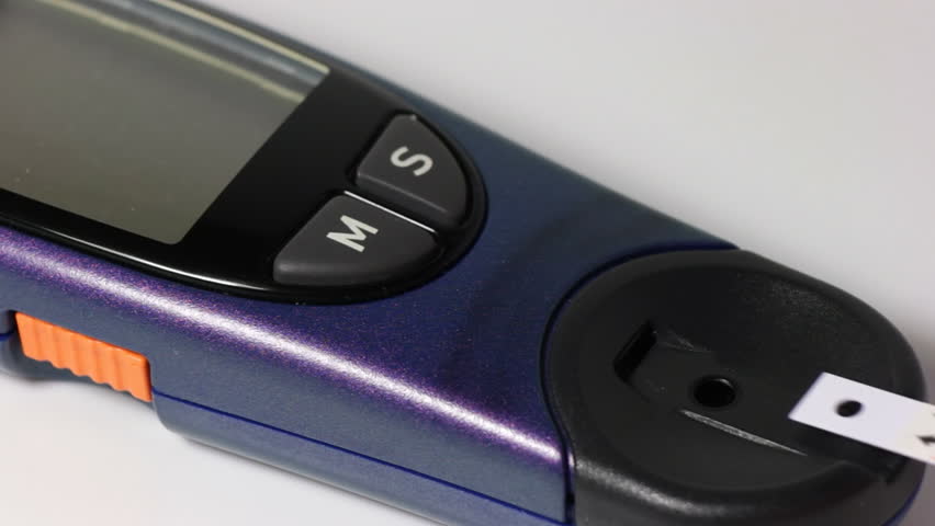 Insert a test strip into the glucometer