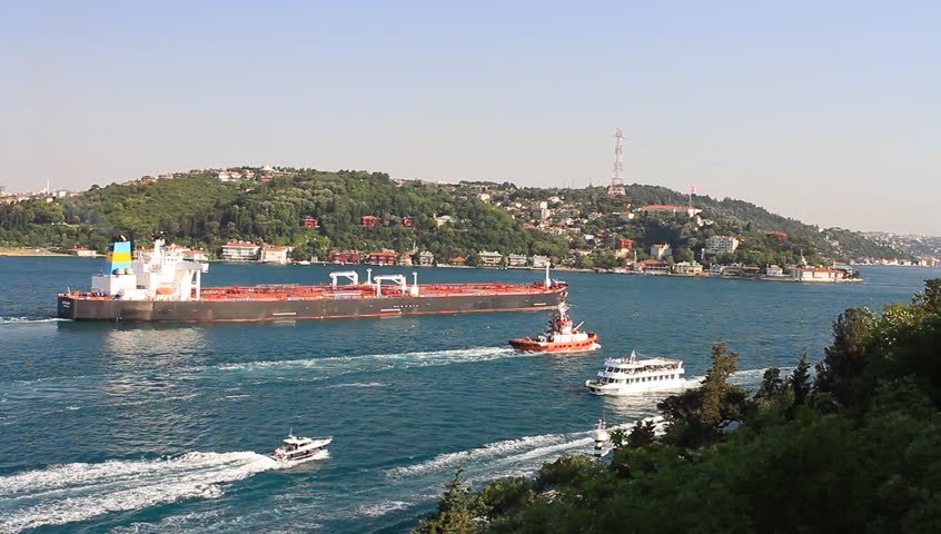 Crude oil tanker with a tug boat sails through Straits Bosporus in Istanbul, Turkey
