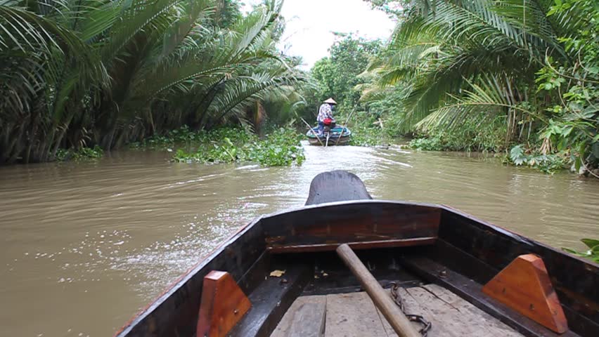 Boat on a canal near Can Tho river in Mekong delta, Vietnam