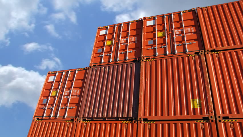 Time lapse of a containers in port against sky