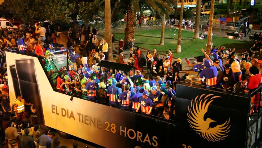 LAS PALMAS DE GRAN CANARIA, SPAIN - FEBRUARY 18: 200,000 masked revelers and a hundred or so festooned cars and floats in the Grande Parade (Gran Cabalgata ) of the Carnival February 18, 2012, Spain 