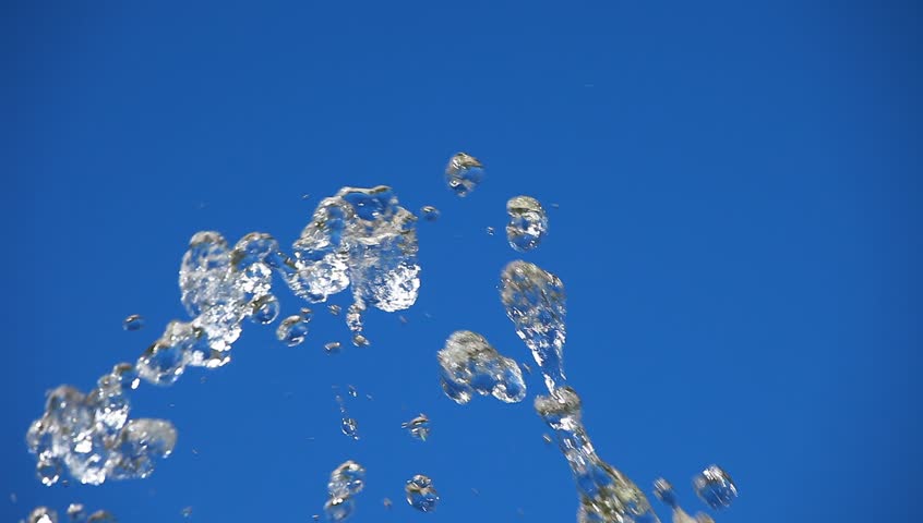 Water splashing over blurred background