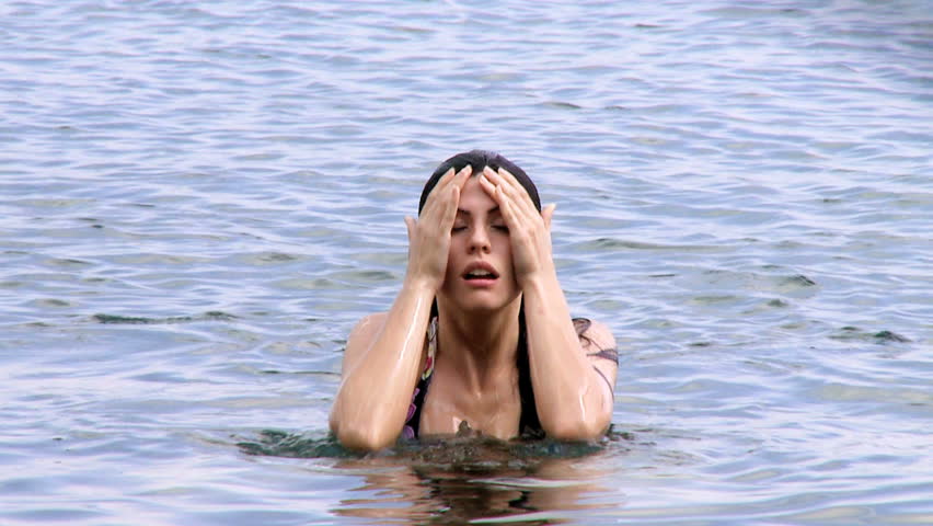 Beautiful young woman coming out of water sexy slow motion/Hot female model out of water sexy