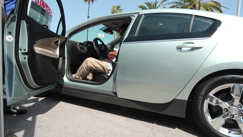 LOS ANGELES - MAY 6: Attendees test drive a Chevy Volt at the 26th Electric Vehicle Symposium on May 6, 2012 in Los Angeles. The event proved popular as a variety of models were made available.