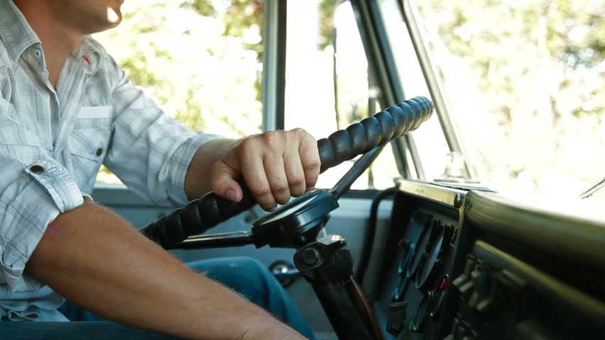 Lorry Driver at the Wheel of Truck, Closeup