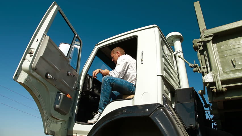 Truck Driver in Cab Using Mobile Phone