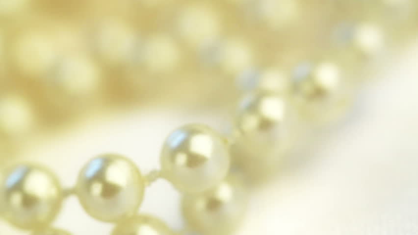 wedding background. beads on silk spinning closeup