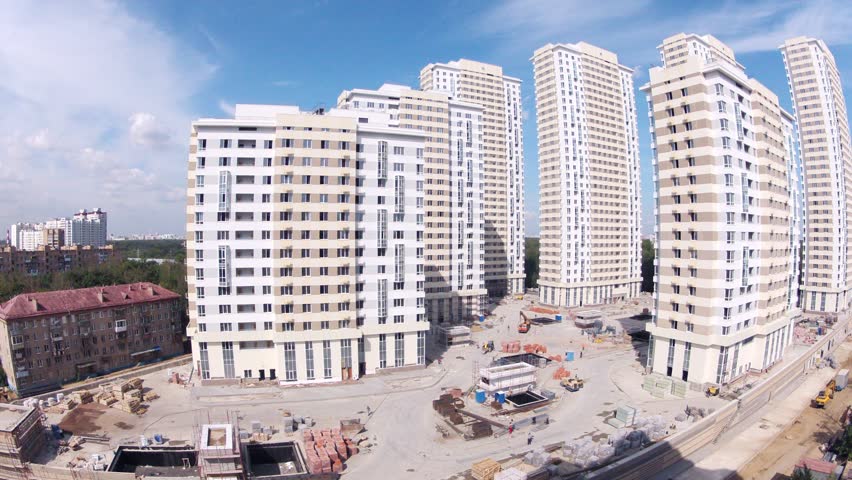 MOSCOW - AUG 6: (Timelapse View) Housing estate Ekopark Elk Island (Losiniy Ostrov) stands near trees against blue sky, builder Donstroy, on Aug 6, 2012 in Moscow, Russia