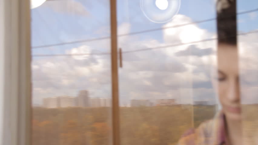 Woman cleaning window