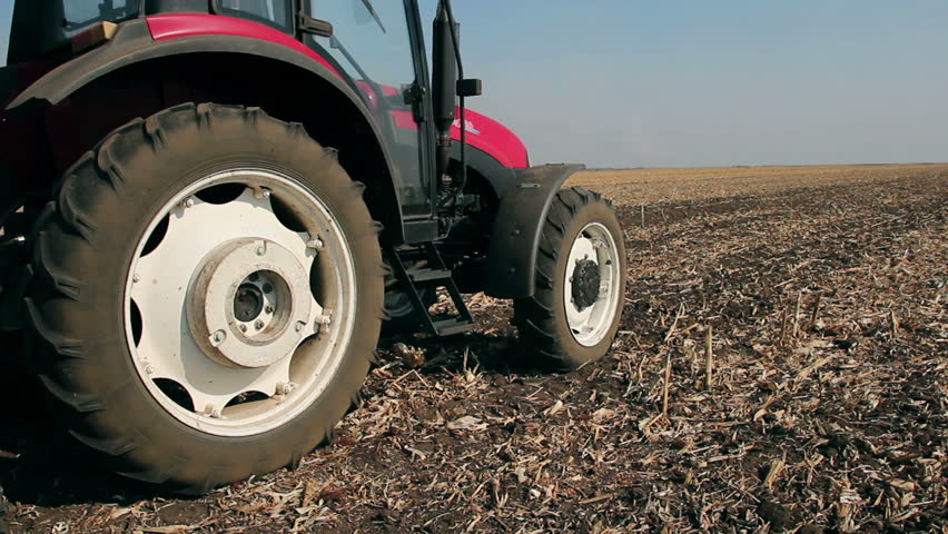 Farmer Sowing Wheat.
Tractor with sowing machine sowing wheat in autumn. HD1080p.
