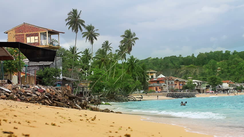 a lush shot of unawatuna beach, sri lanka