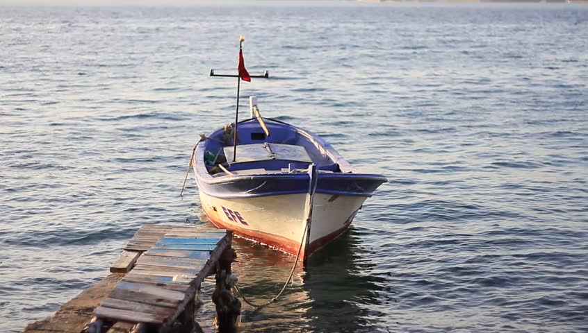 ISTANBUL - APRIL 7: A rowing fisher boat at berth in Pasabahce Marina on April 7, 2012 in Istanbul. Fishing contributes a significant income at Bosporus Sea of Turkey.
