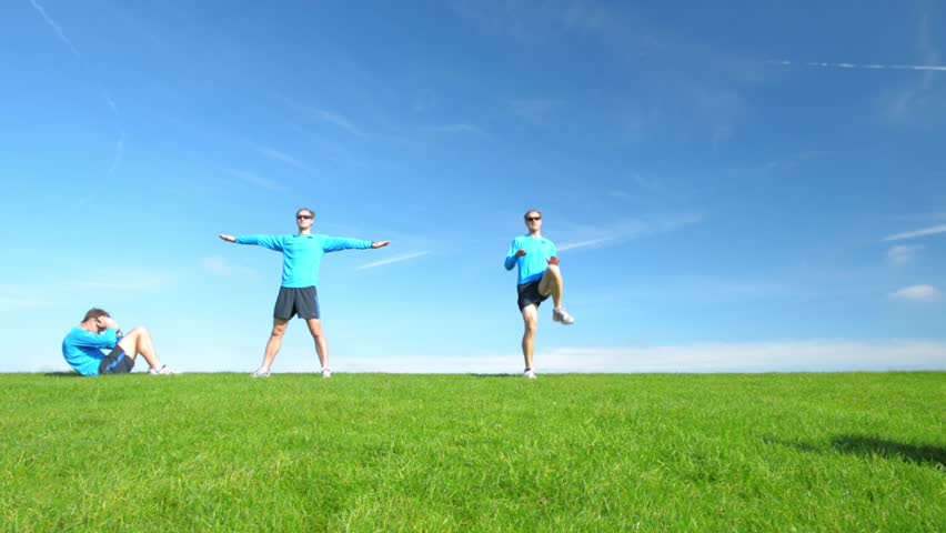 Healthy young men exercising outdoors high definition video