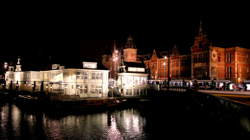 City scenic with the Central Station in Amsterdam the Netherlands at night