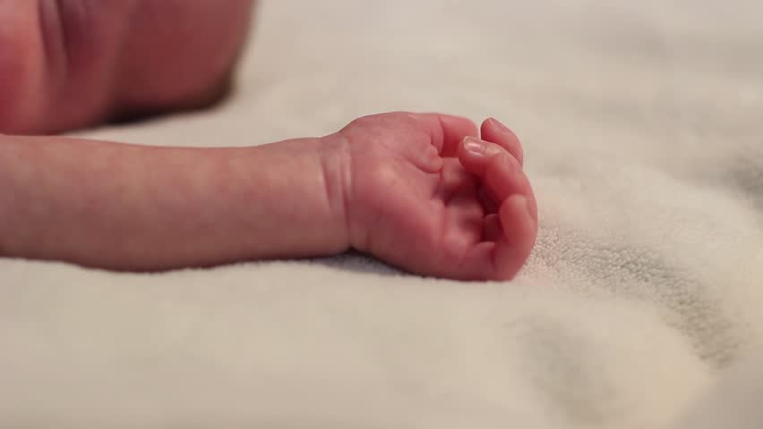 Baby sleeping crying in red and diaper