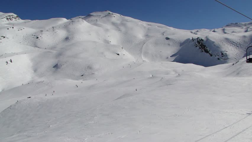 Watching open slope mogul skiers from a moving chairlift 		in Avoriaz, in the Portes du Soleil, France
