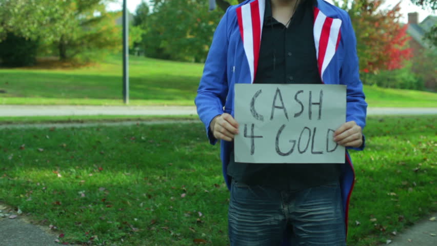 Gold exchange guy with a sign