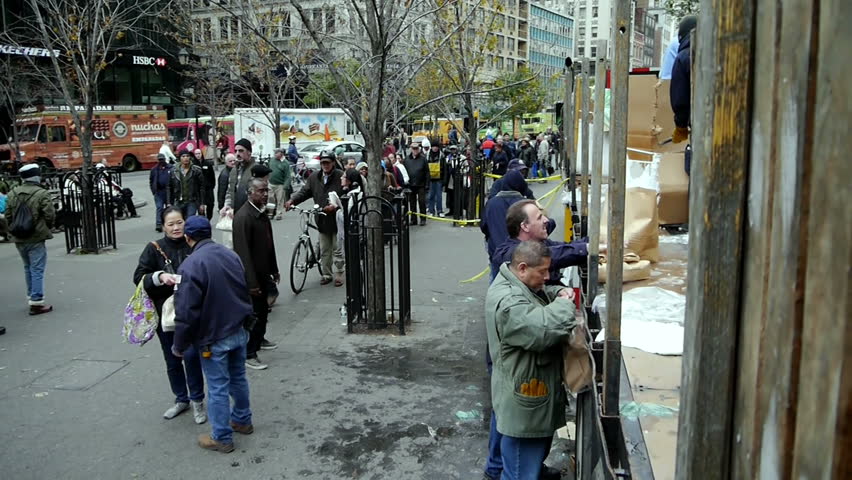 NEW YORK - NOVEMBER 2:  People wait in line for Con Edison hand outs of dry ice for their refrigerators in Union Square Park  on November 2, 2012 in New York City.