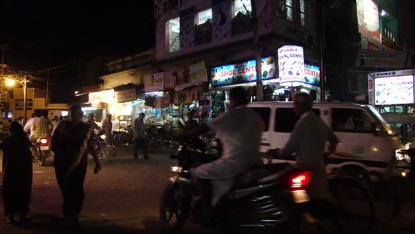 HYDERABAD, INDIA - NOV 22 - 	Night traffic in Hyderabad, India. Pedestrians, motorbicycles and cars share the road on an autumn evening		 on Nov 22, 2009, in Hyderabad, India.
