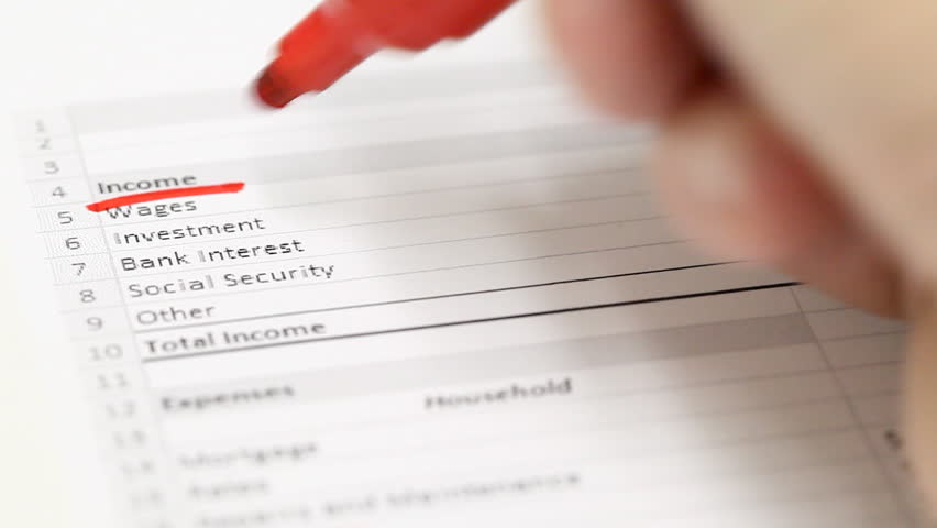 Man checking household budget numbers - money saving concept